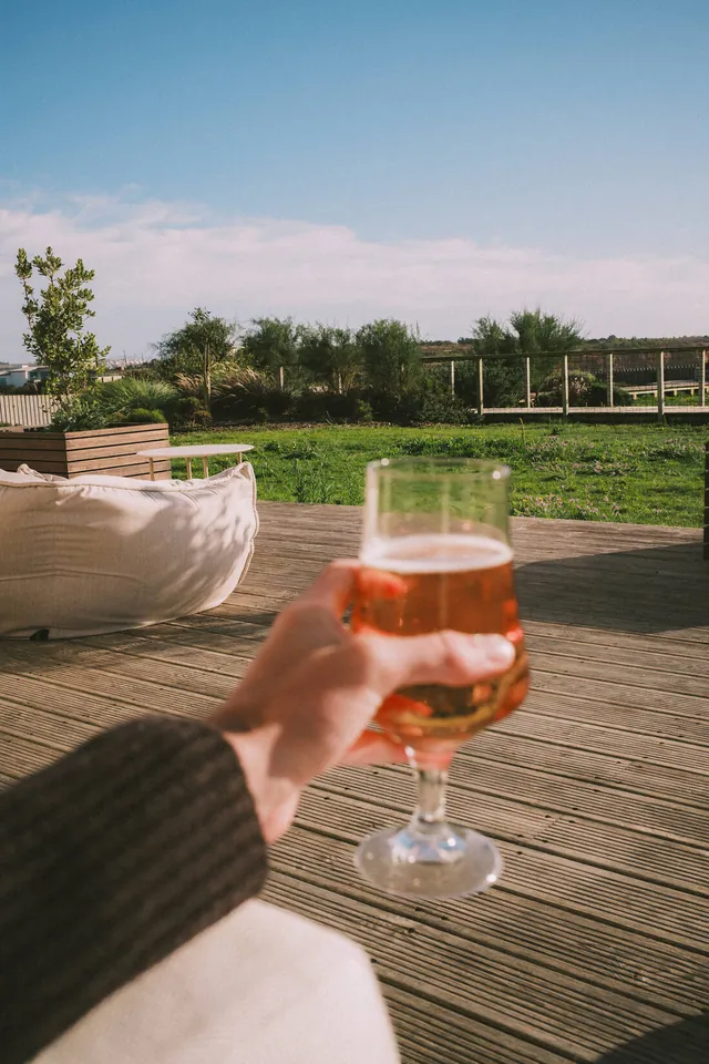 A cold beer on the wood deck overlooking the gardens