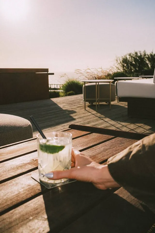 Sunset cocktail on the wood terrace